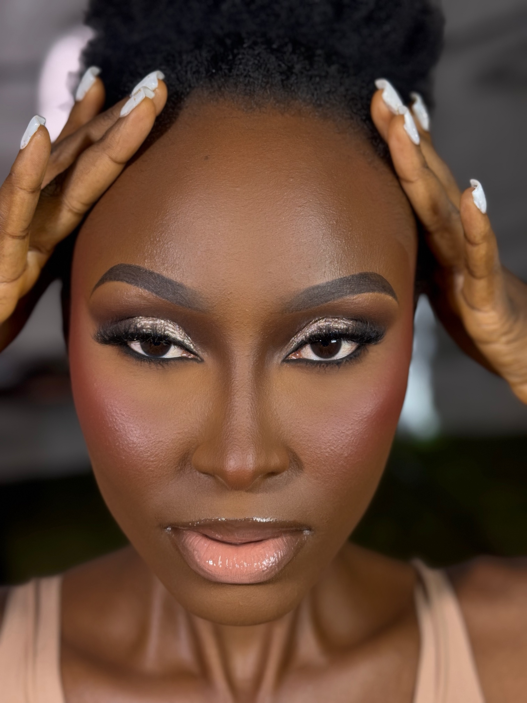 METALLIC FOCUS makeup on a Black Ghanaian woman