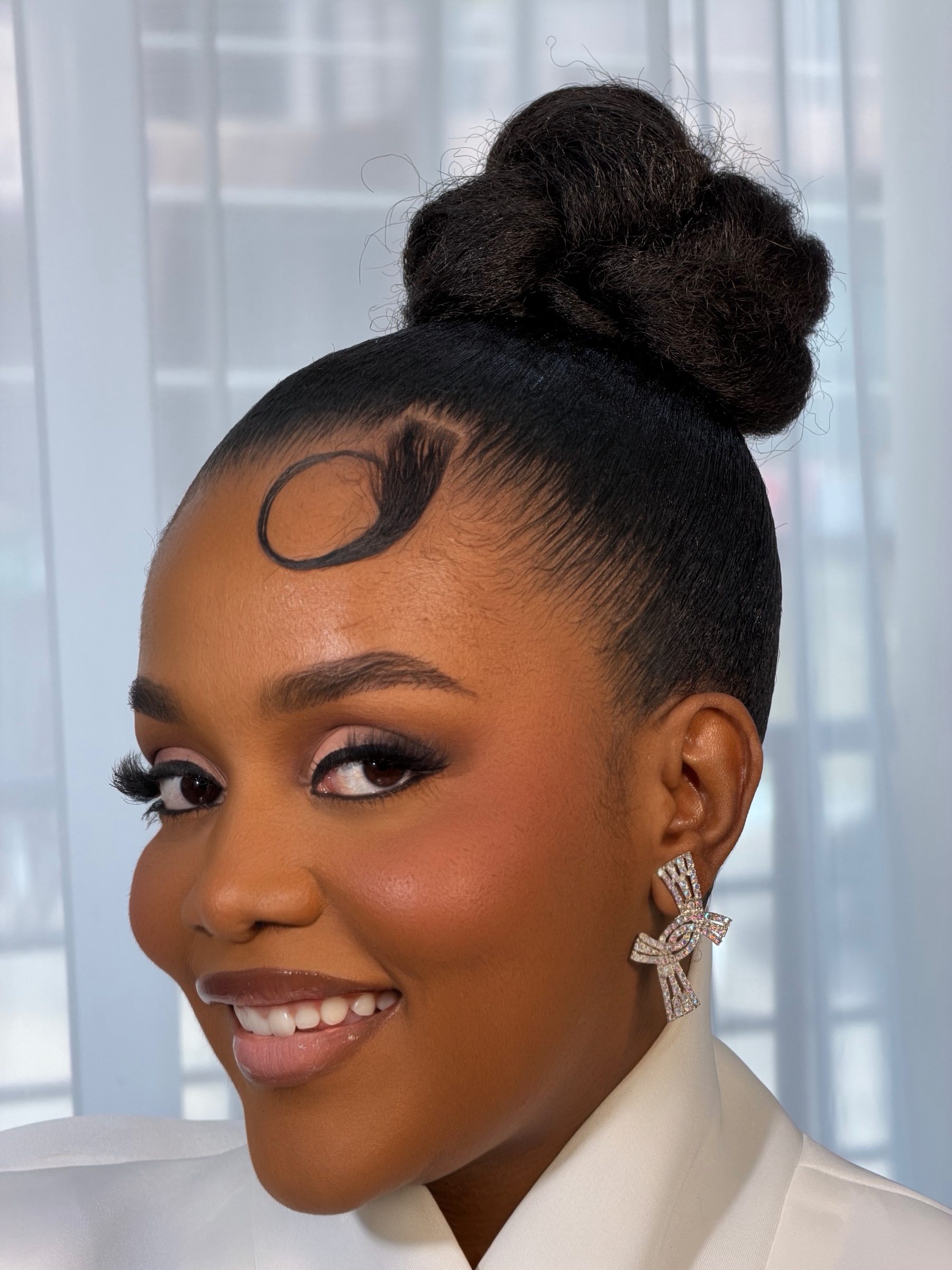 Sculptural High Bun on a Black Ghanaian woman